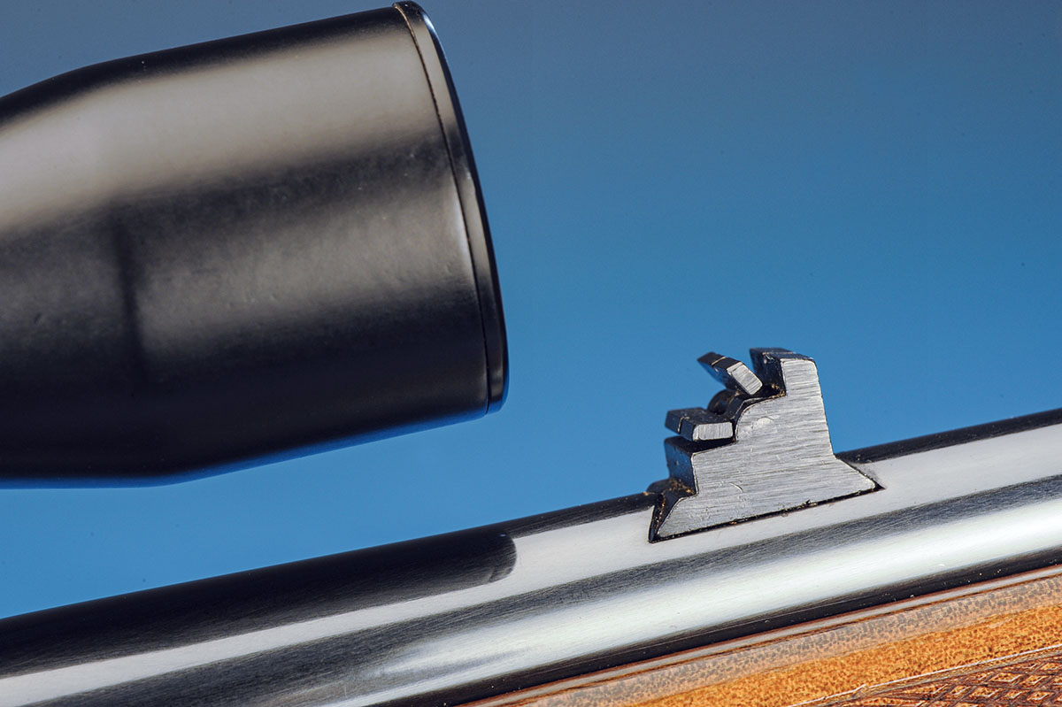 The rear sight has three blades that offer the shooter distances of 50, 75 and 100 yards. The blade to the right is stationary, while the other two flip up or down for the distance you want to shoot.